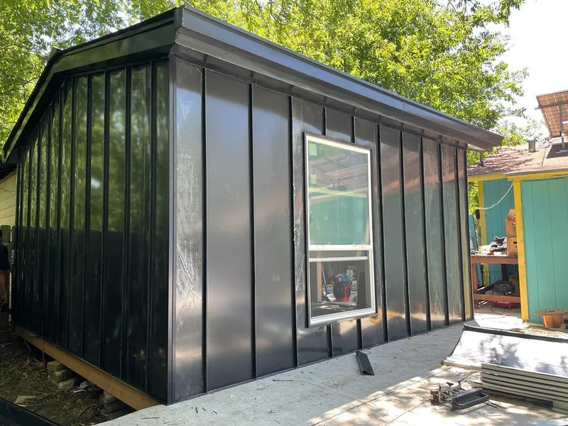 Black standing seam metal wall panels for Roof Inspection in Rigby